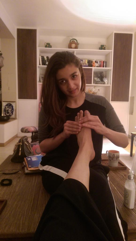 Alia Bhatt doing foot massage to Mahesh Bhatt