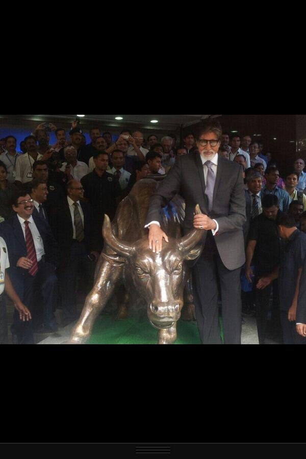 Amitabh Bachchan with The Bull. 'Rung the Bell' at the Bombay Stock Exchange and held the horns of the 'Bull..promotion for YUDH..thank you BSE for this honour.