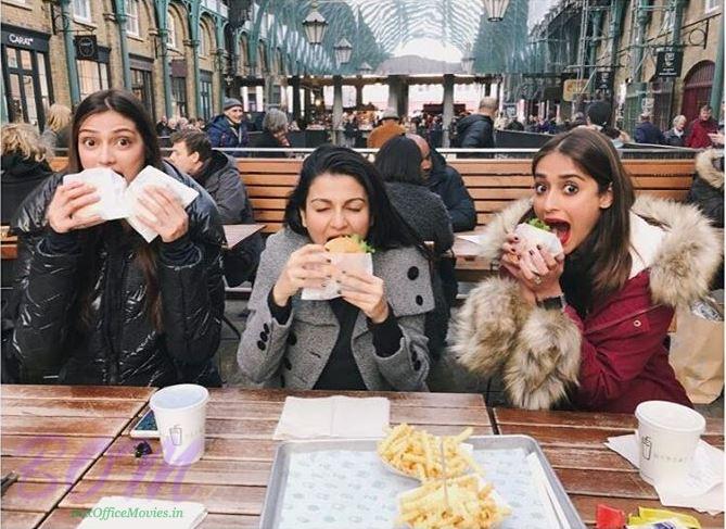 Athiya Shetty stuffing the face with Ileana Dcruz on a freezing Monday