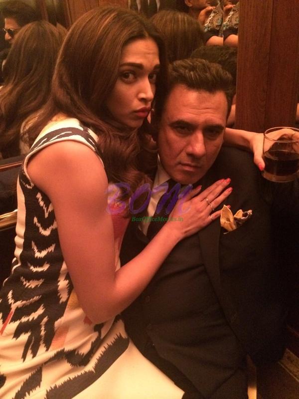 Boman Irani hot picture with Deepika Padukone holding a wine glass in hand. Boman is looking awesome in this photo, even after at this age.