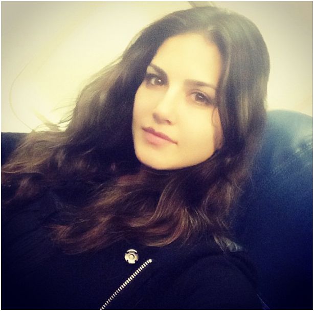 Do you recognize if she is Sunny Leone - on a plane and almost off to bed