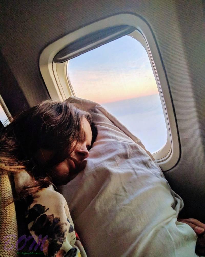 Evelyn Sharma sleeping selfie from an airplane travel