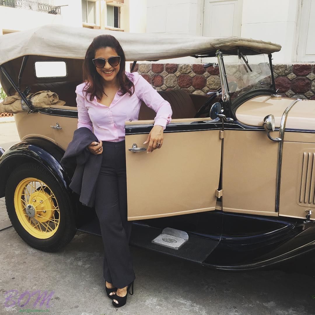 Kajol Devgn with a vintage car