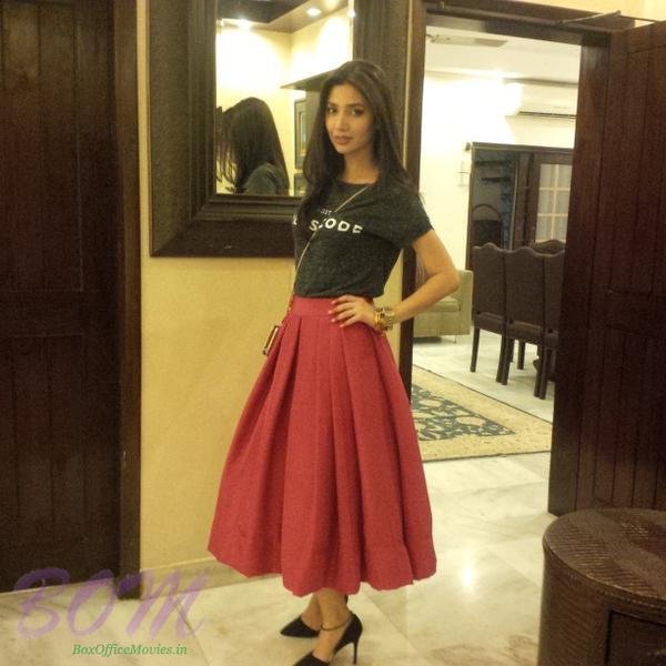Mahira Khan wearing a gorgeous red skirt by Elan paired with a Mango Tee