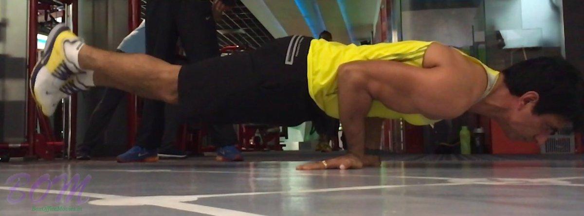 Sonu Sood doing a Mayurasana Yoga pose