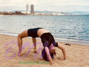 Taapsee Pannu doing chakrasana in Barcelona Beach sands