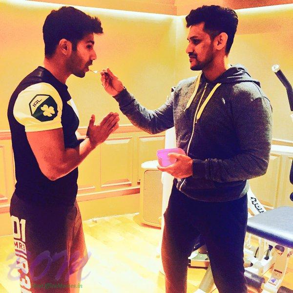 Trainer Prashant Sawant gives a sweet potatoe to Varun Dhawan after a hard workout