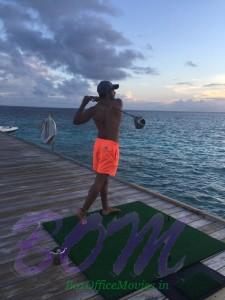 Varun Dhawan hitting some eco friendly golf balls into the ocean