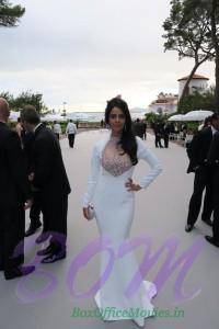 Mallika Sherawat ‏at amfAR wearing Georges Hobeika gown and Swarovski clutch