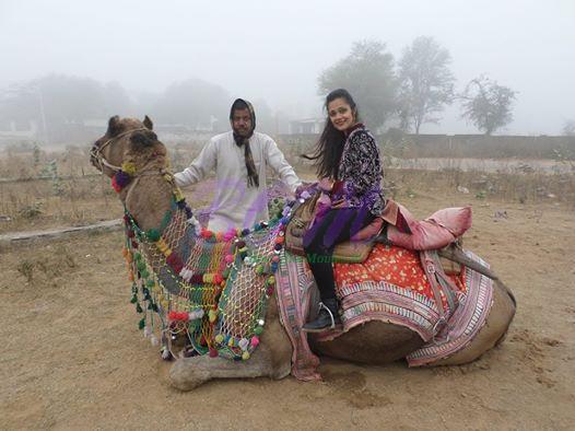 Sheena Chohan Feeling Christmassy on a camel ,in a desert