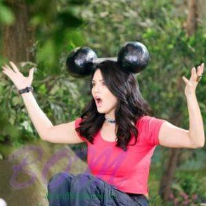 Sunny Leone holding a dumbell on her head